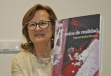 Hoy visita la caseta del Grupo Oretania y Lo Que Te Da La Gana, Begoña Mansilla, coordinadora de “Velos de realidad” libro póstumo del poeta Manuel Muñoz Moreno